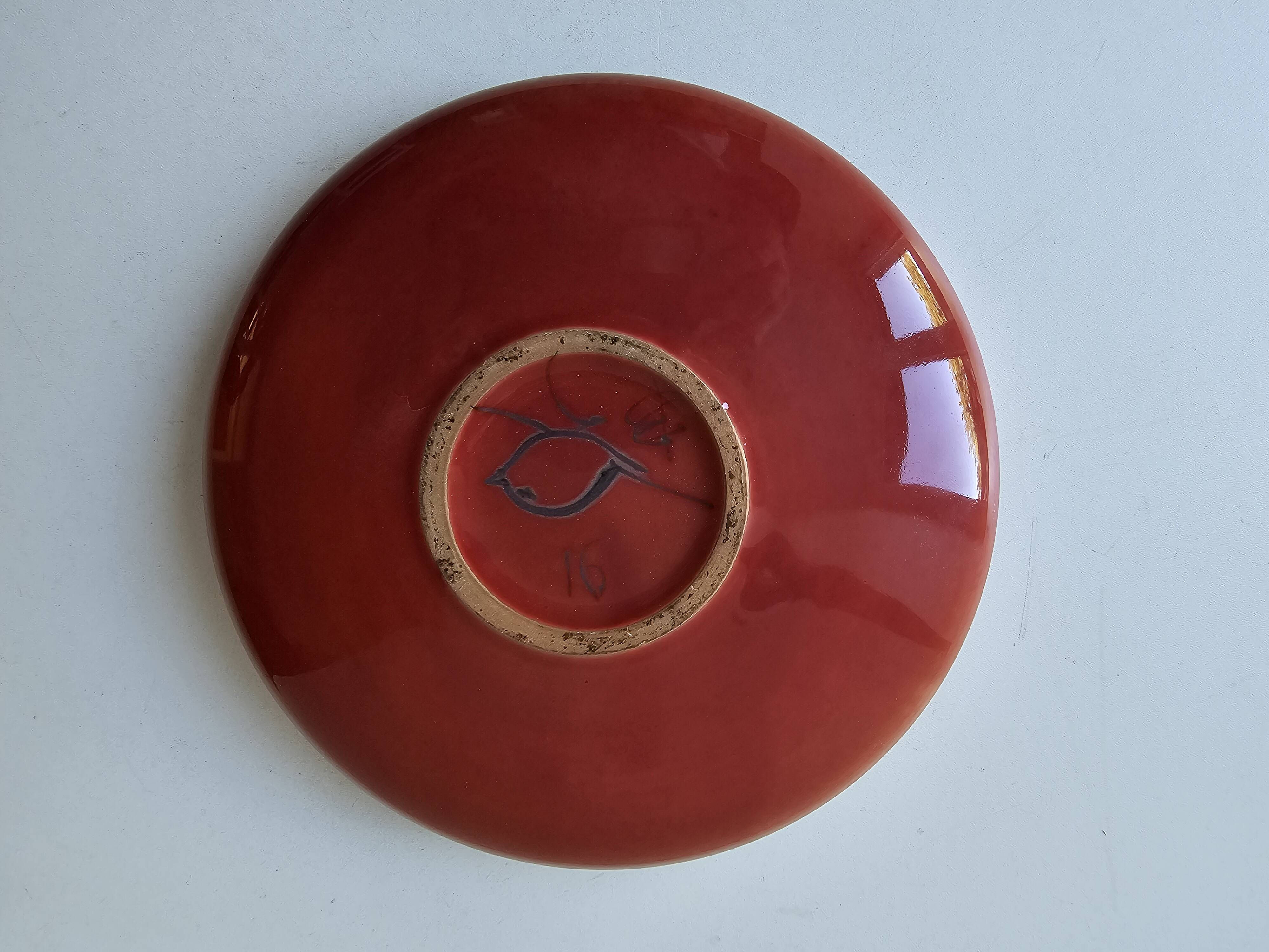 Red enamelled ceramic bowl emptier by Alain Déjardin