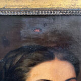 Old oil painting on canvas portrait of a woman with a red bow, late 19th century