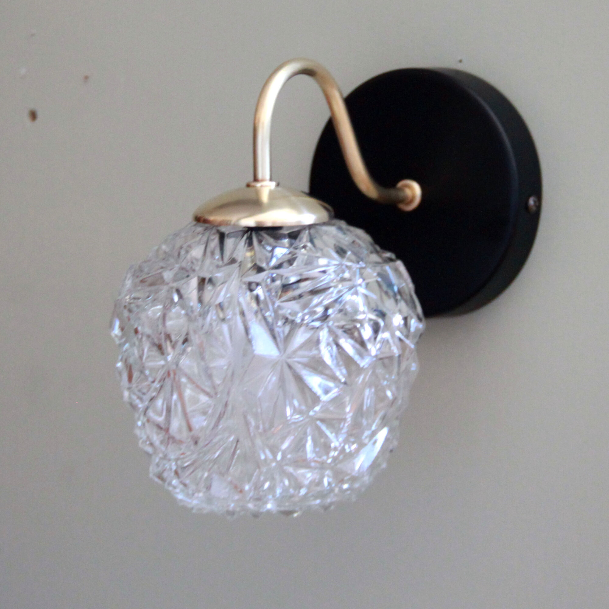 Pair of brass wall sconces and thick glass globe vintage luminaire