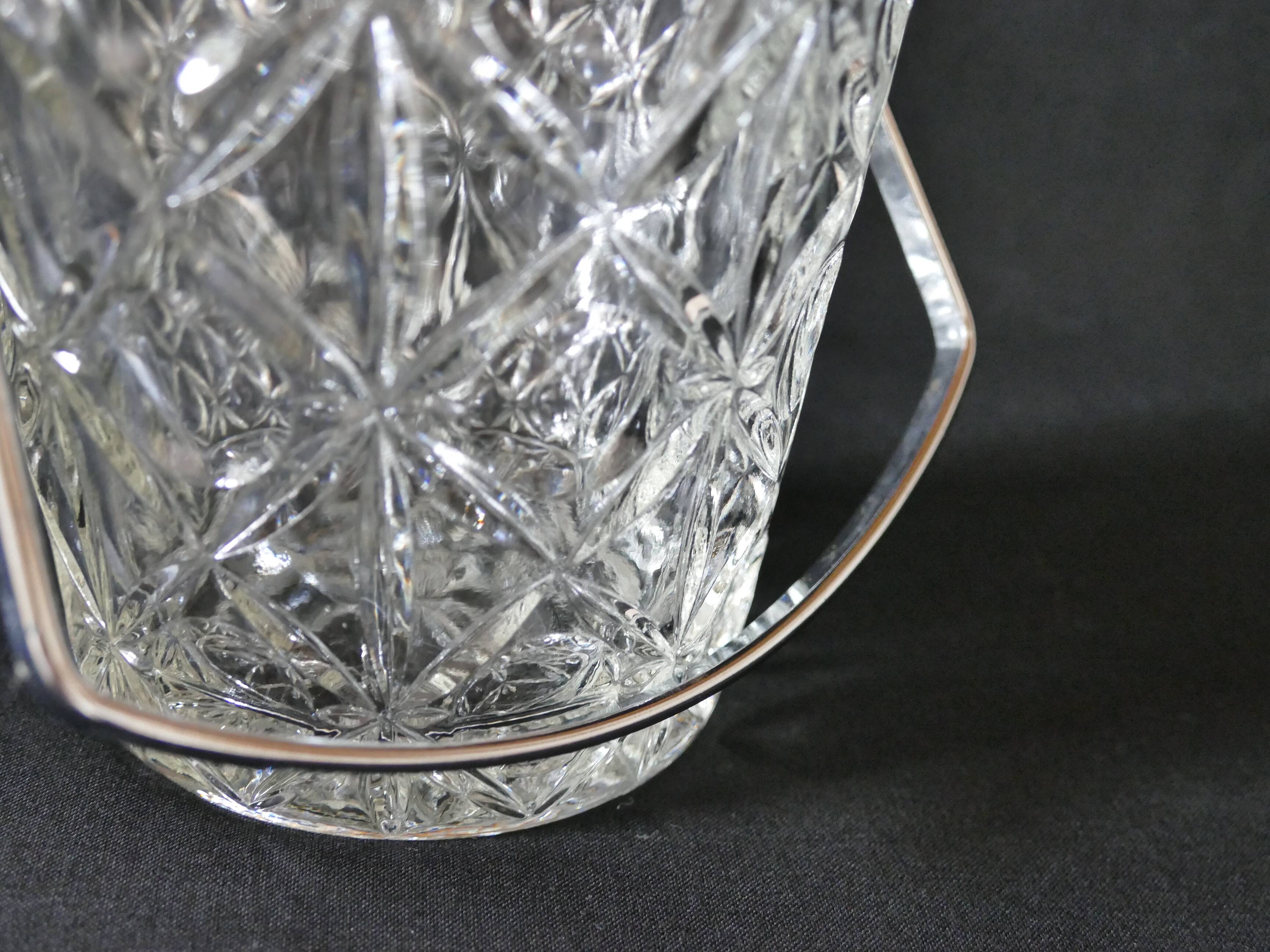 Vintage glass ice bucket stamped with a metal handle