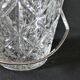 Vintage glass ice bucket stamped with a metal handle