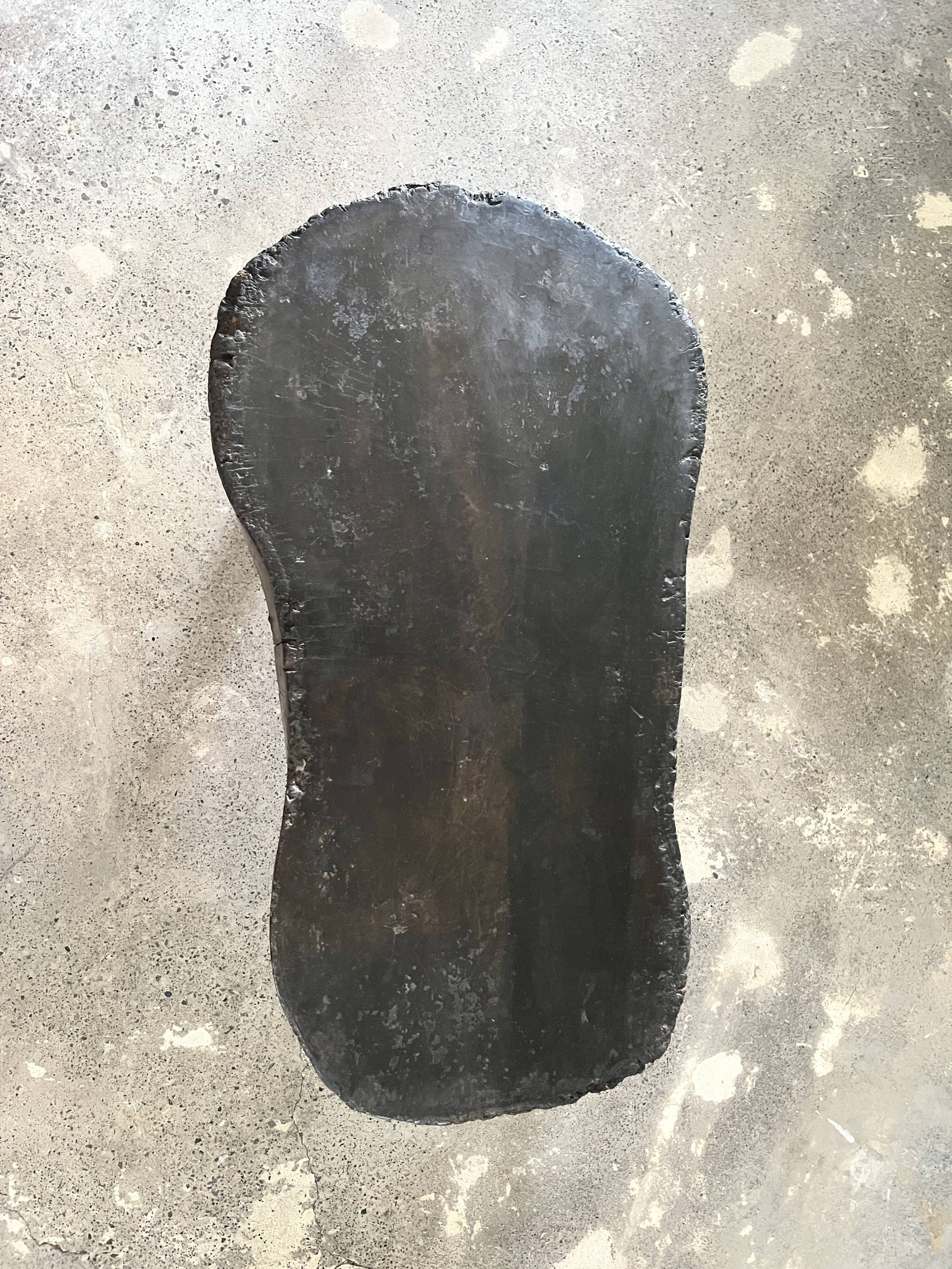Small old Asian wooden coffee table in Japanese style, kidney-shaped top