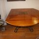 Square cherry wood table with drop leaves.