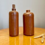 Set of two bottles or jugs in ocher-brown enamelled sandstone