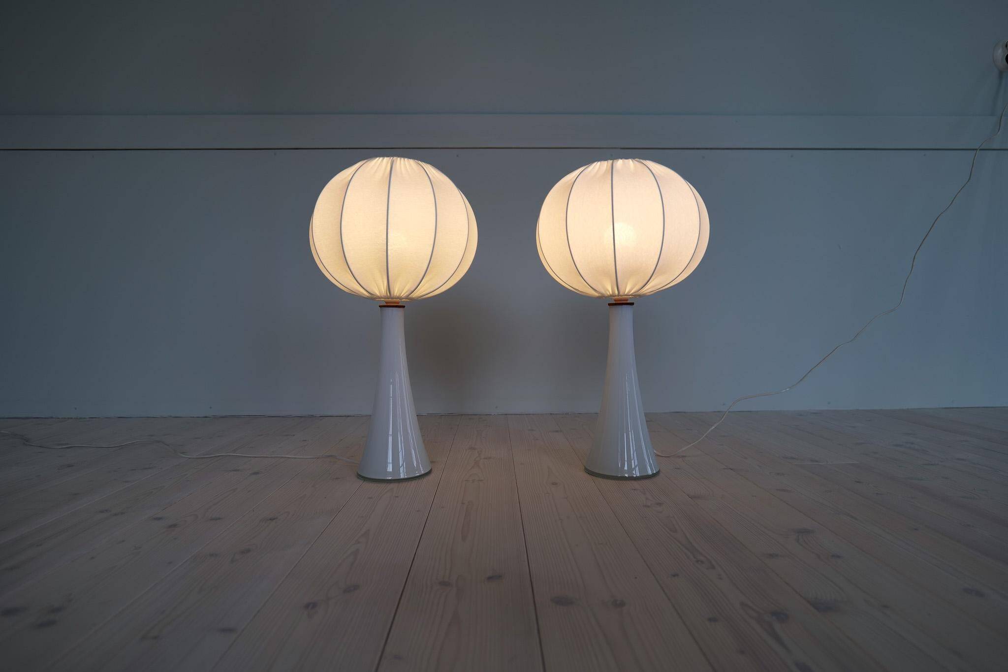 Pair of mid-century opaline glass table lamps with cotton shades by Bergboms, Sweden, 1960.