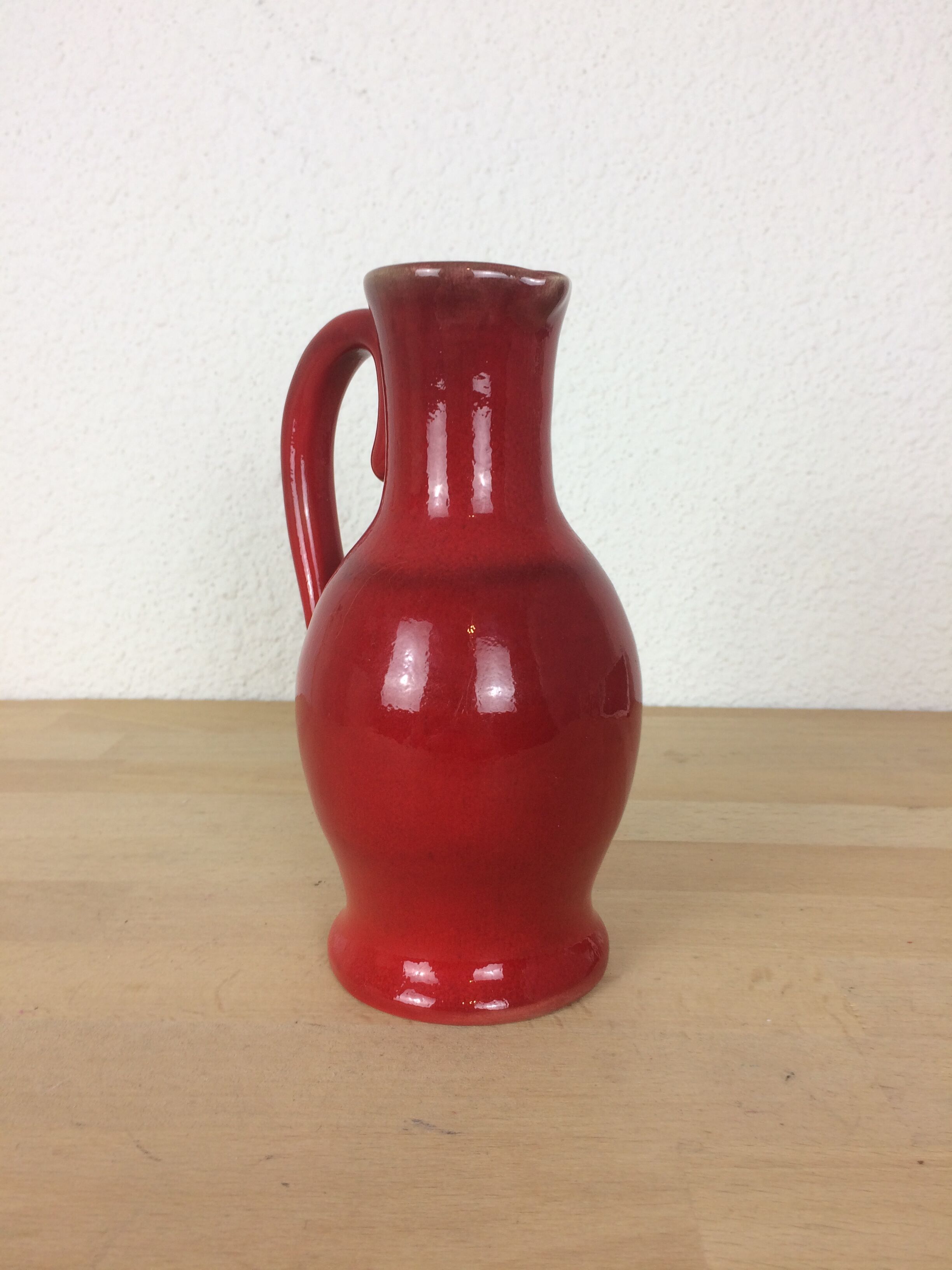 Red ceramic pitcher
