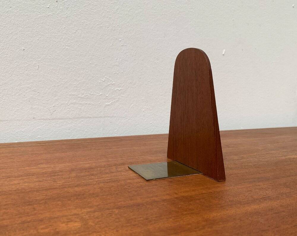 Mid-century Scandinavian bookends in teak and brass.