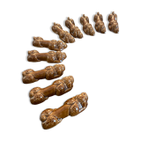 10 ceramic knife holders in the shape of a recumbent poodle