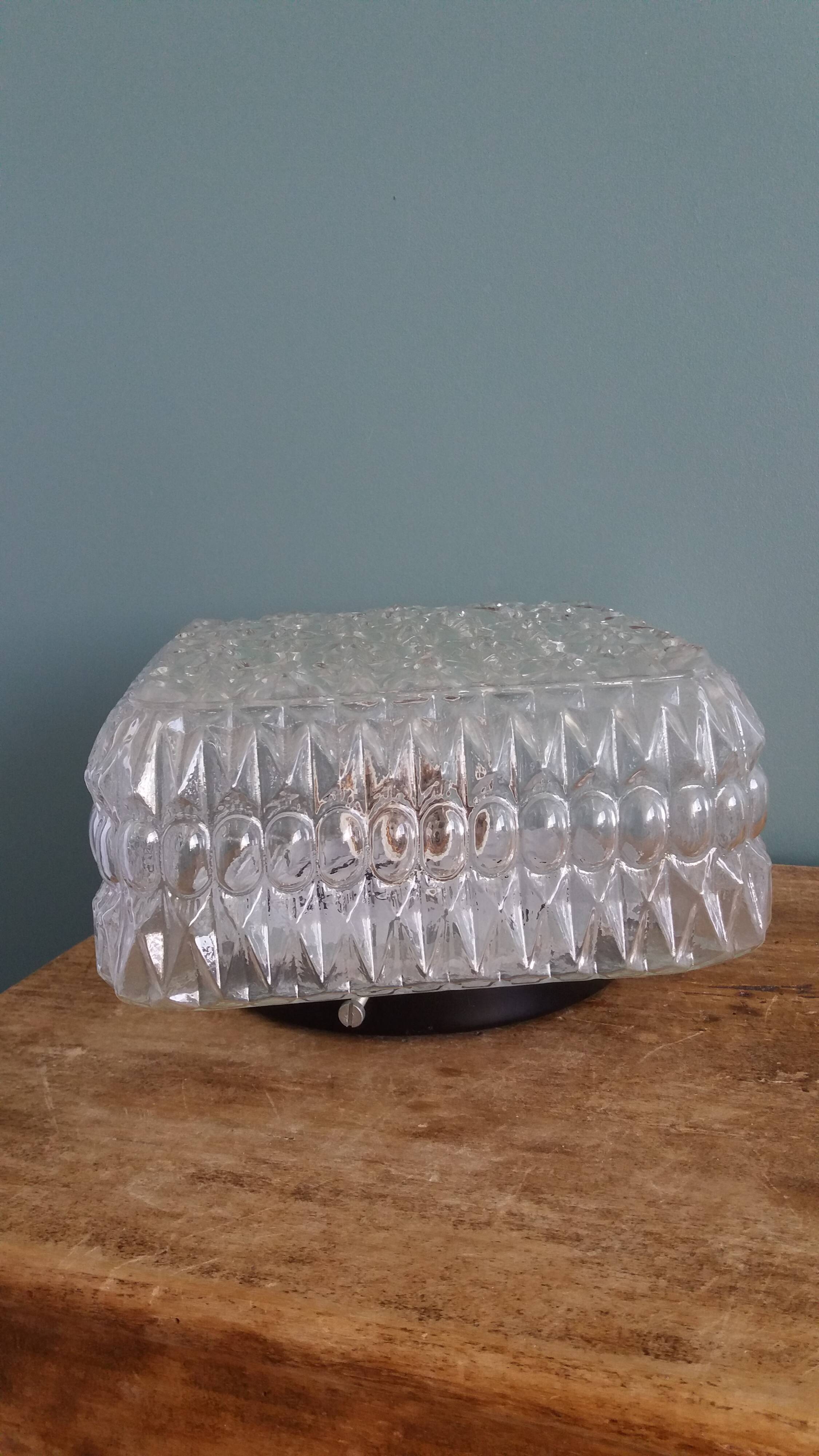 Square globe ceiling light in moulded glass.
