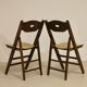 Pair of vintage folding chairs year 50 sculpted backrest.