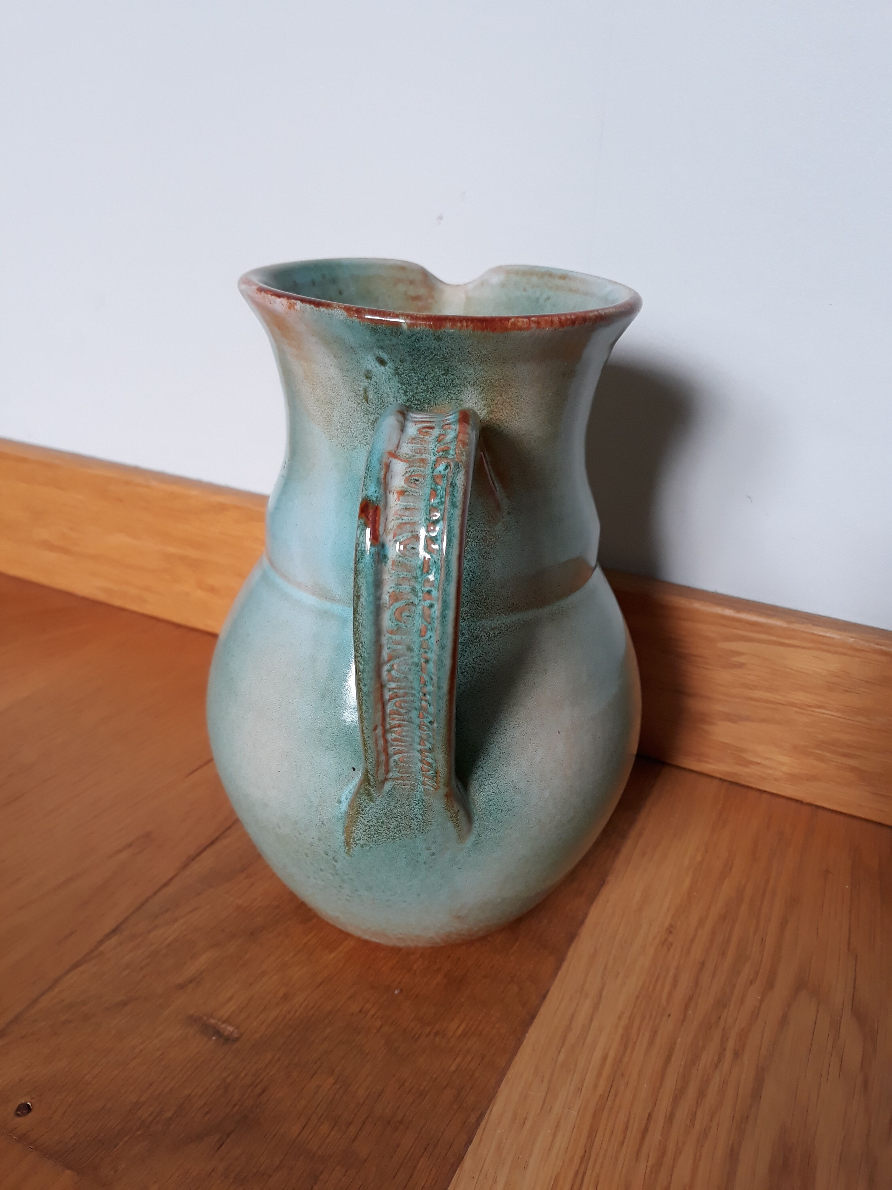 Pitcher with handle green celadon turquoise and caramel