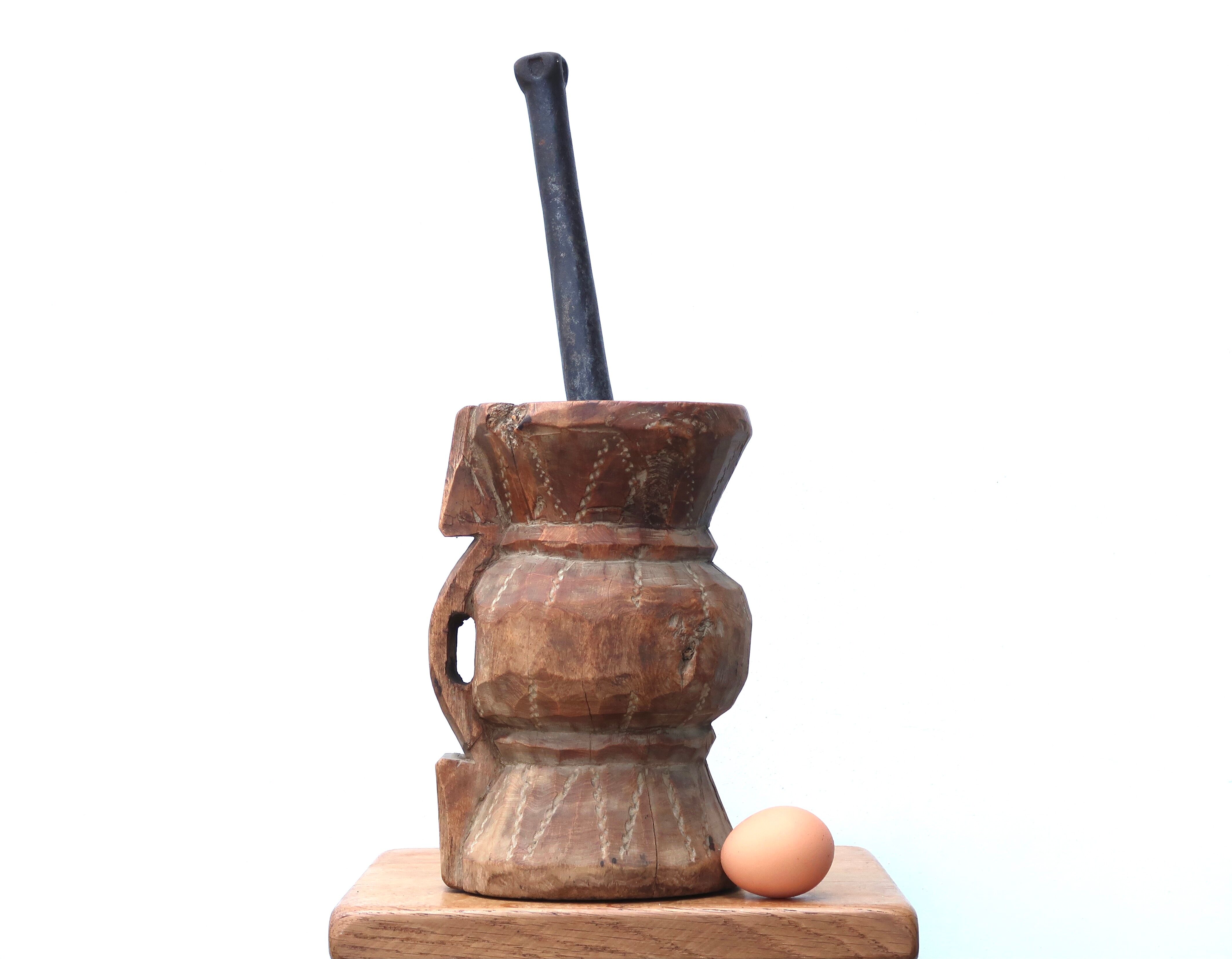 African mortar in carved wood, cast iron pestle, 70s