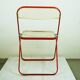 Red Plia Lucite folding chair by G. Piretti for Castelli Italy