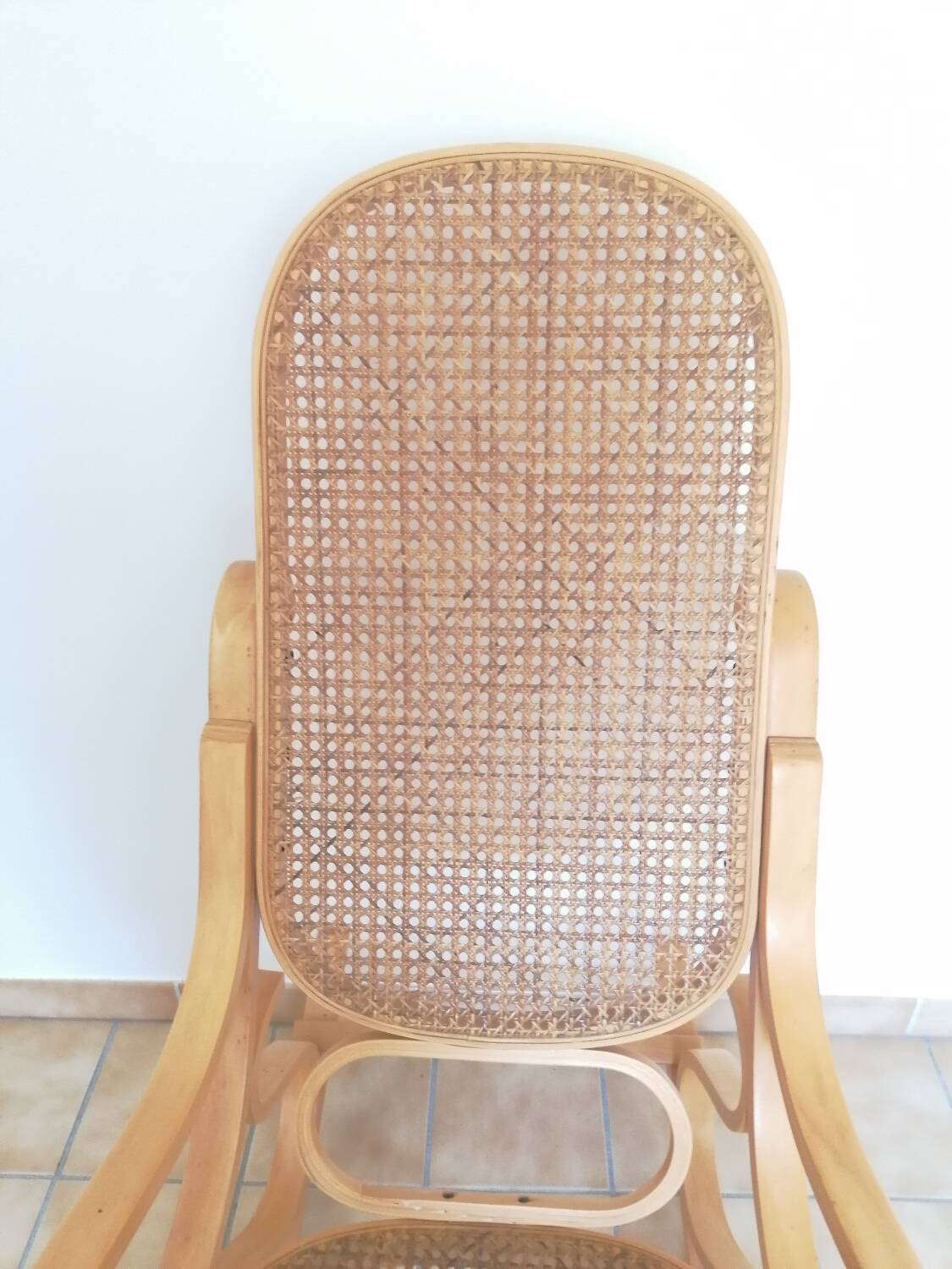 Wooden and cane rocking chair