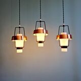Trio of Scandinavian pendant lights in opaline and copper metal, 1960s