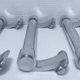 three long aluminum shop handles from the mid-20th century