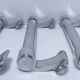 three long aluminum shop handles from the mid-20th century