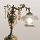 Bronze table lamp with dragon arm and cut glass shade, 1940s