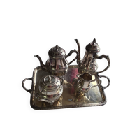 Silver-plated metal set by Christophe with its tray, teapot, and coffee pot.