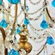 Italian chandelier with blue beads and gilded wood.