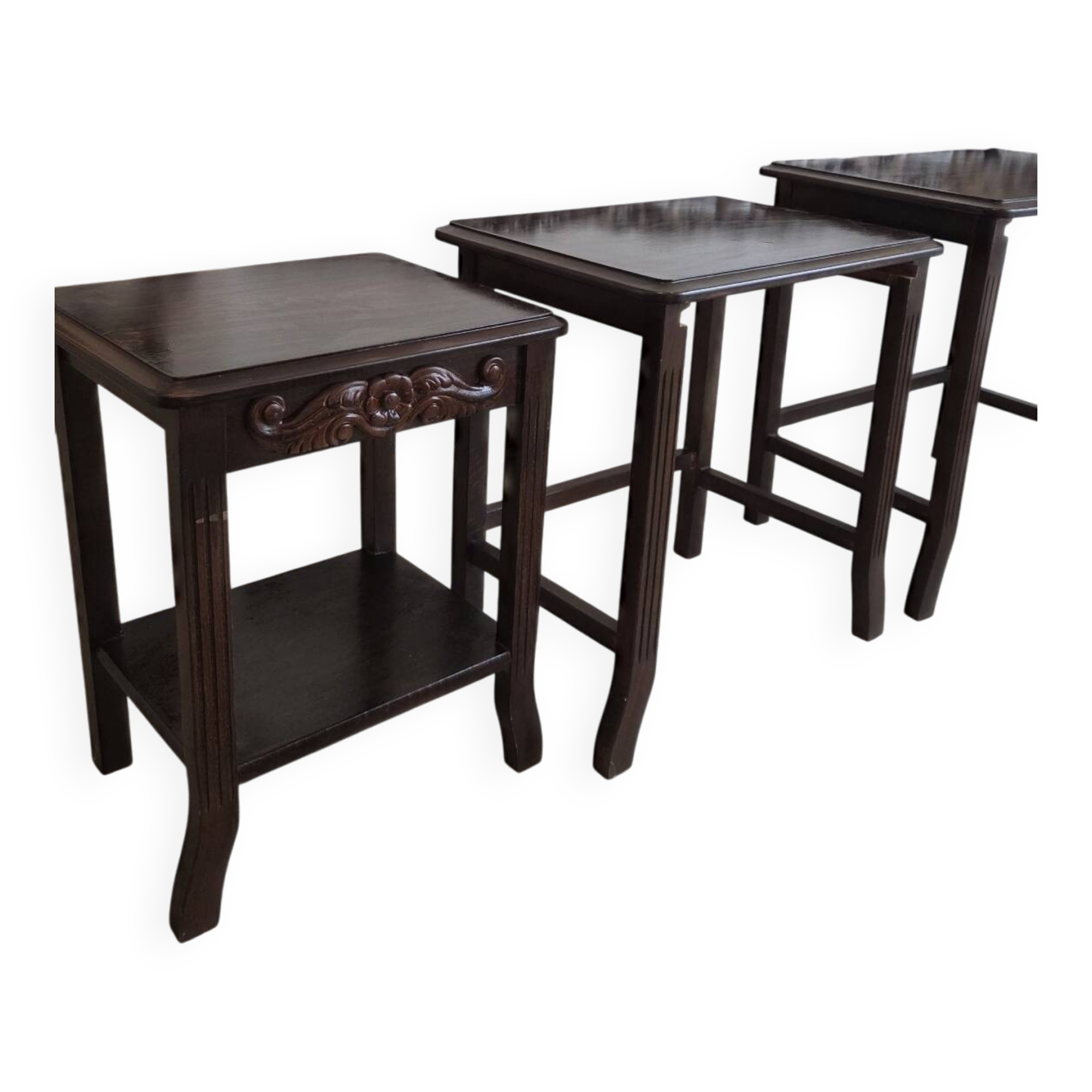 Nested tables made of varnished solid wood.