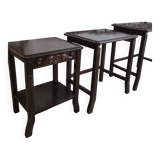 Nested tables made of varnished solid wood.
