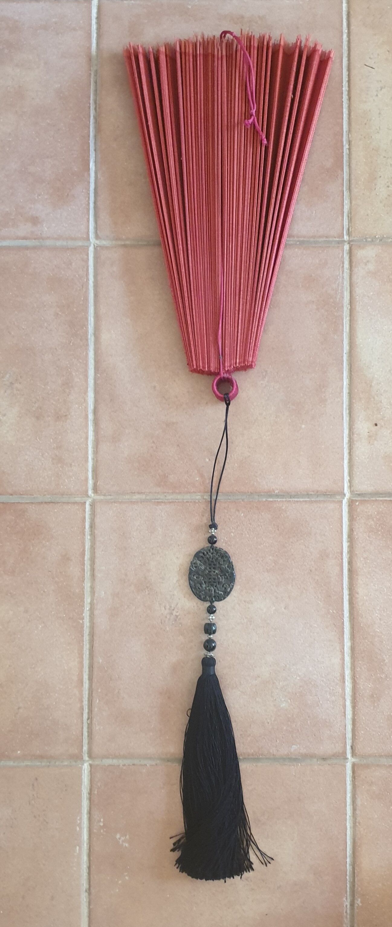 Chinese fan with decorative tassel