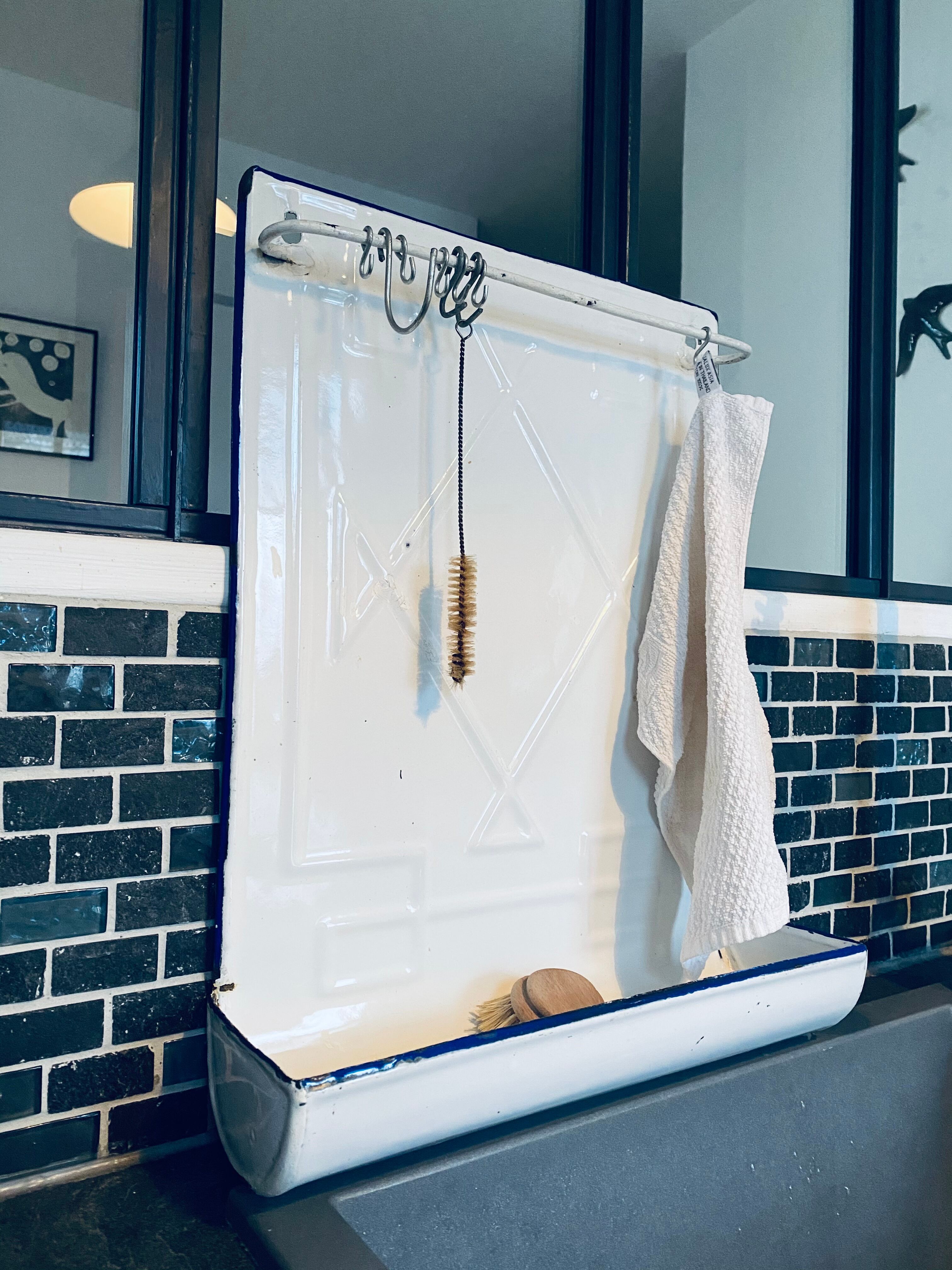 Old enamelled kitchen utensil display