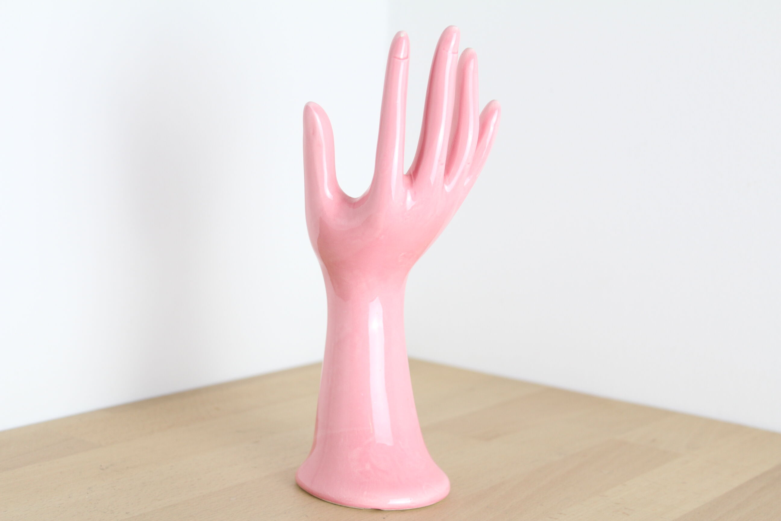 Hand pink ceramic ring sizer doilies