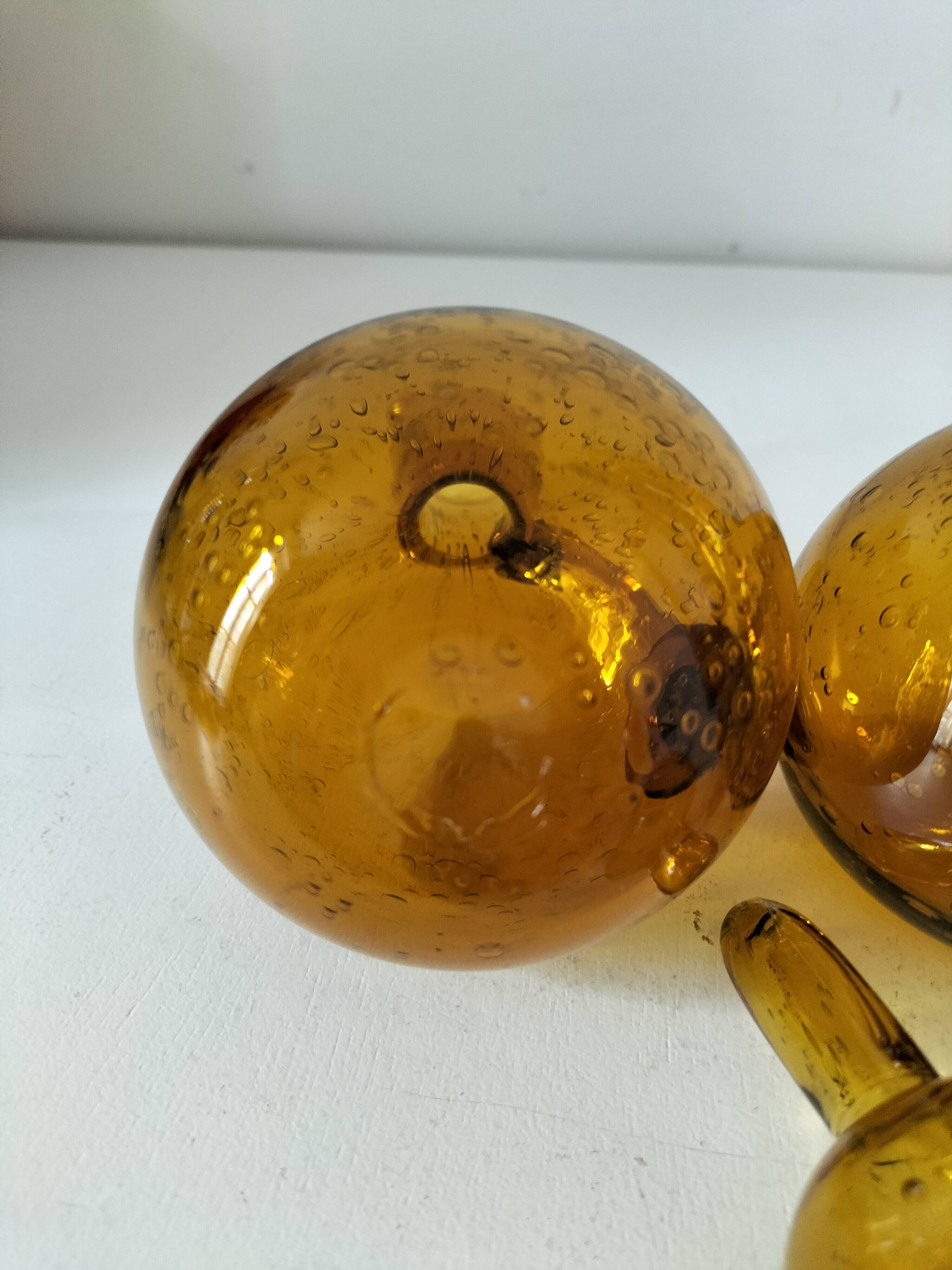 Duo of blown glass carafes – Biot signed – Bubbled amber glass