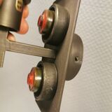 A set of Vitrika Denmark, cast iron wall lights with red details.