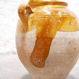 Old gargoulette pot in glazed terracotta