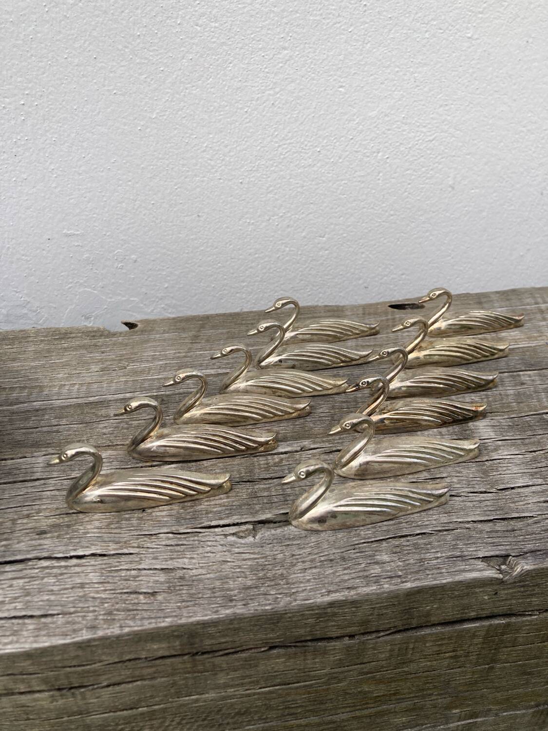 12 duck knife holders in silver metal