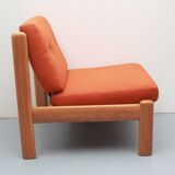 1970s chair in oak and orange cushions