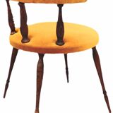 Mustard gondola armchair in the style of Helmut.