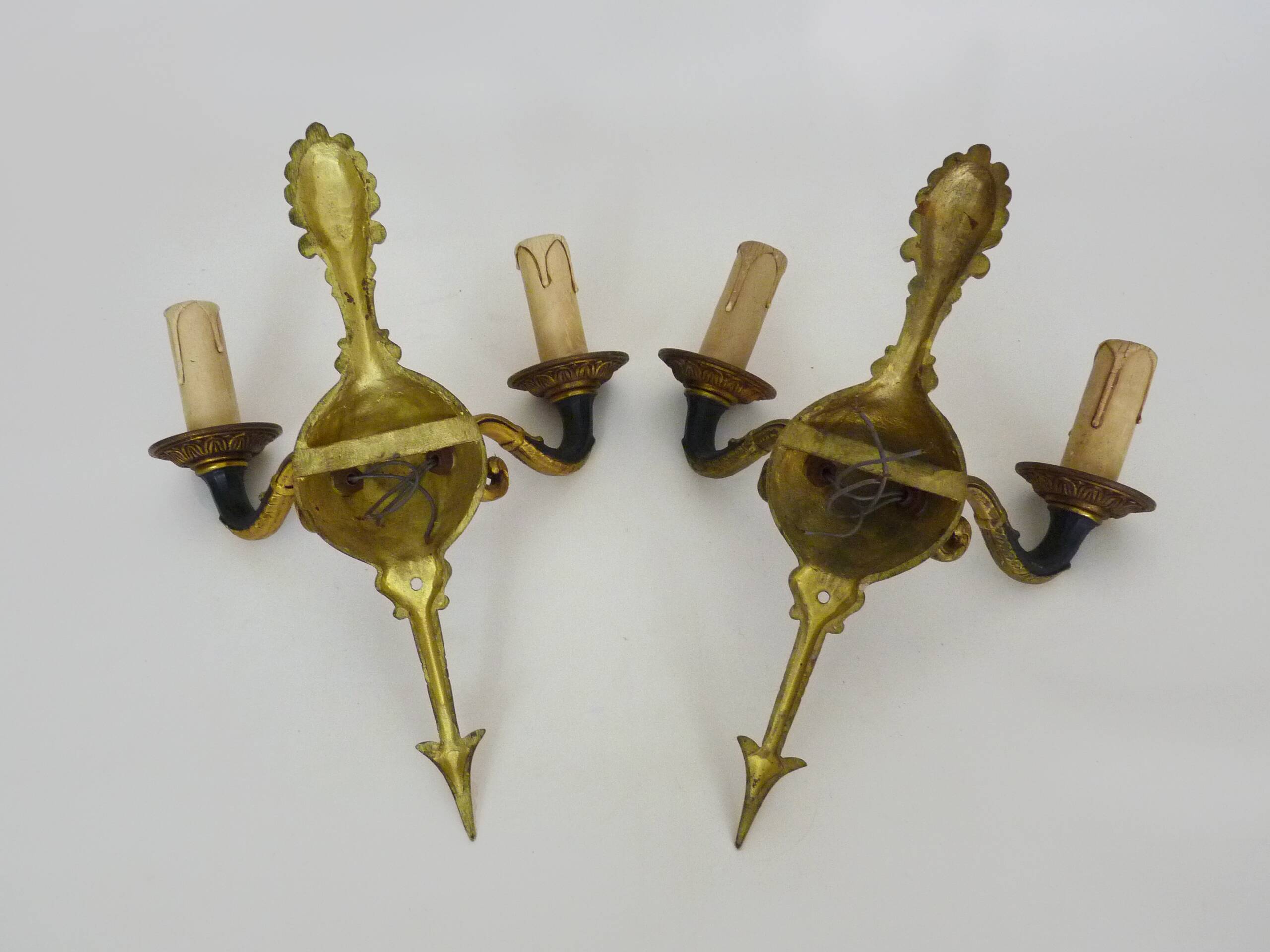 Pair of wall sconces in the Empire style with double lights in bronze.