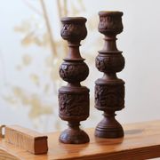 Pair of turned and carved wooden candlesticks