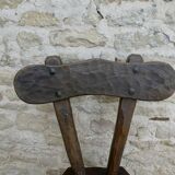 Brutalist chair in carved solid wood, around 1950.