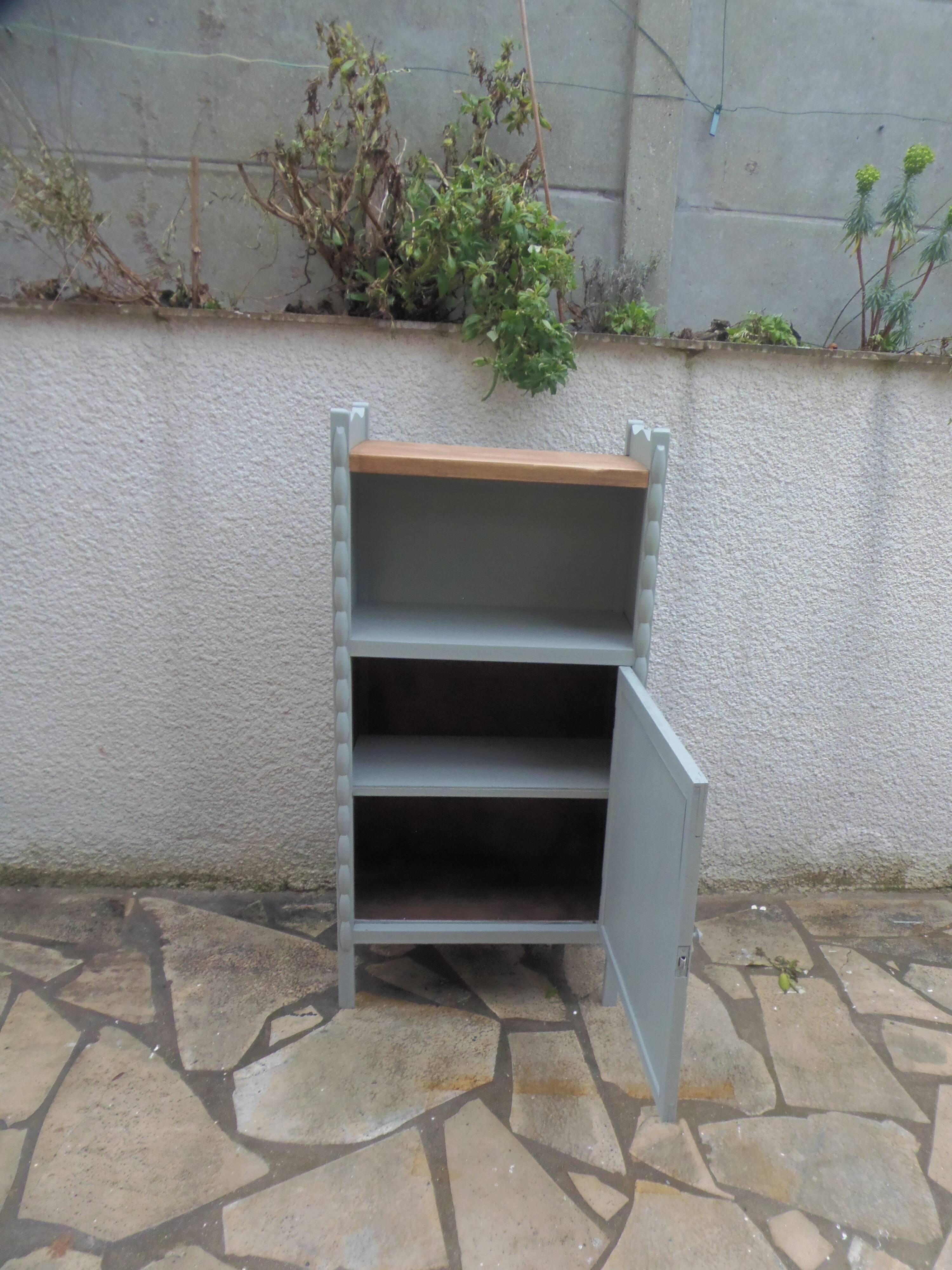Vintage furniture of shallow depth re-enchanted in grey-green.