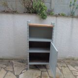 Vintage furniture of shallow depth re-enchanted in grey-green.