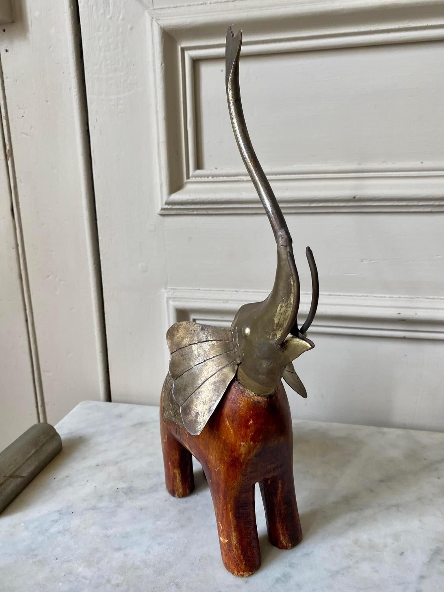 Wooden elephant and brass
