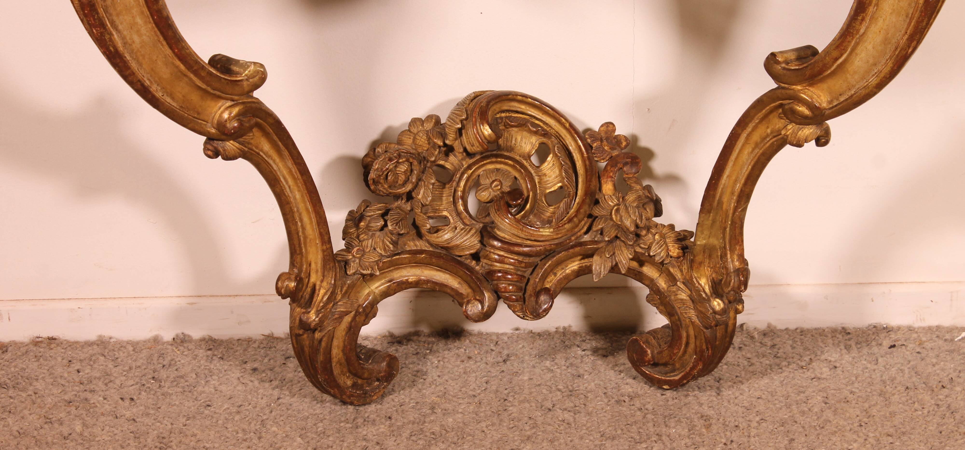 Louis XV period console in gilded wood