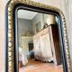Louis-Philippe black and gold antique mirror from the 19th century