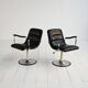 Pair of European 1970s swivel armchairs in faux leather and steel