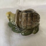 Old snail piggy bank in barbotine