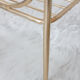 Side table with a golden magazine holder