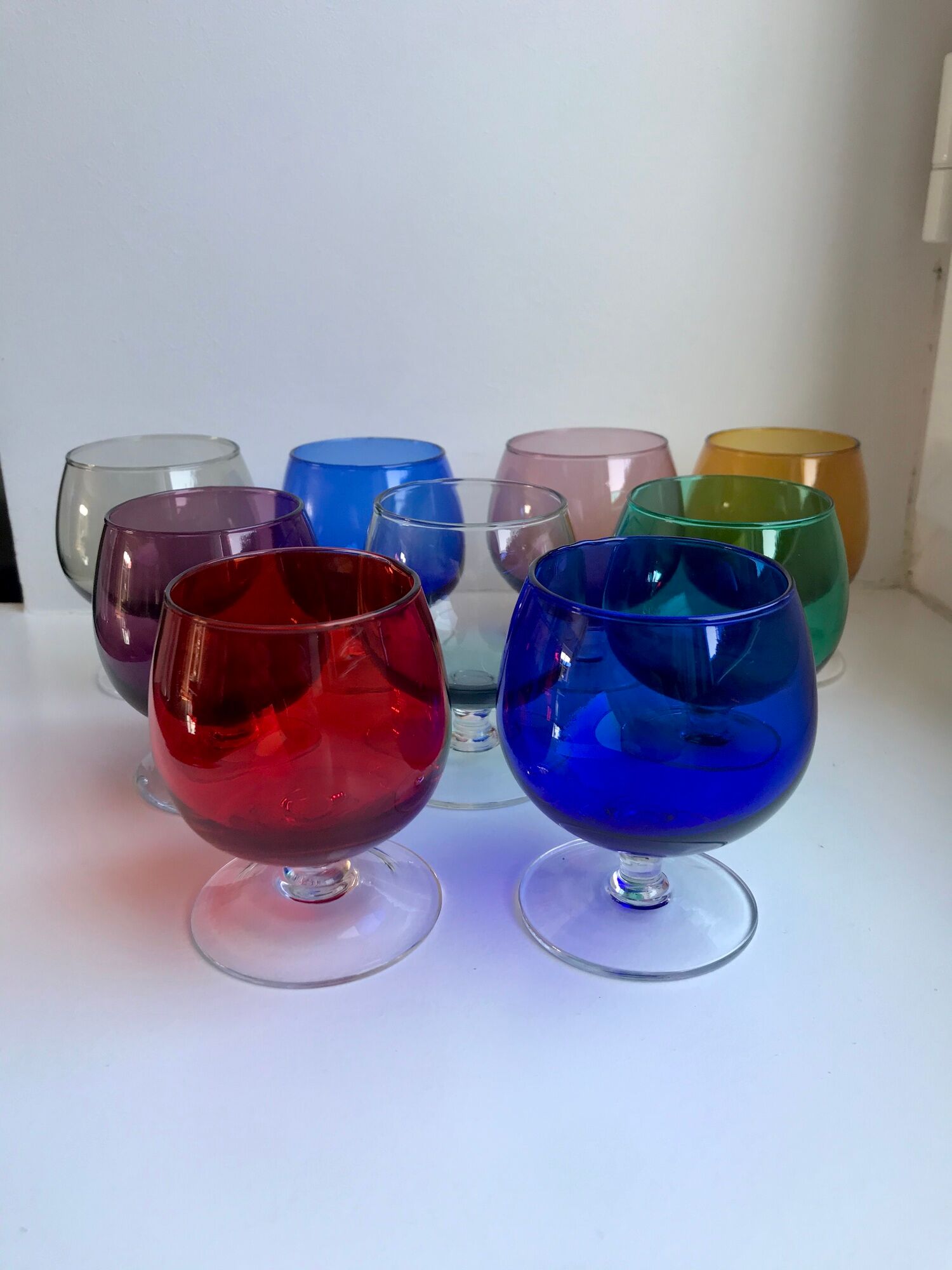 Set of 9 glasses with colored feet in blown glass 50s