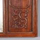 Antique mirror in exotic wood with chinoiserie carvings, 19th century.