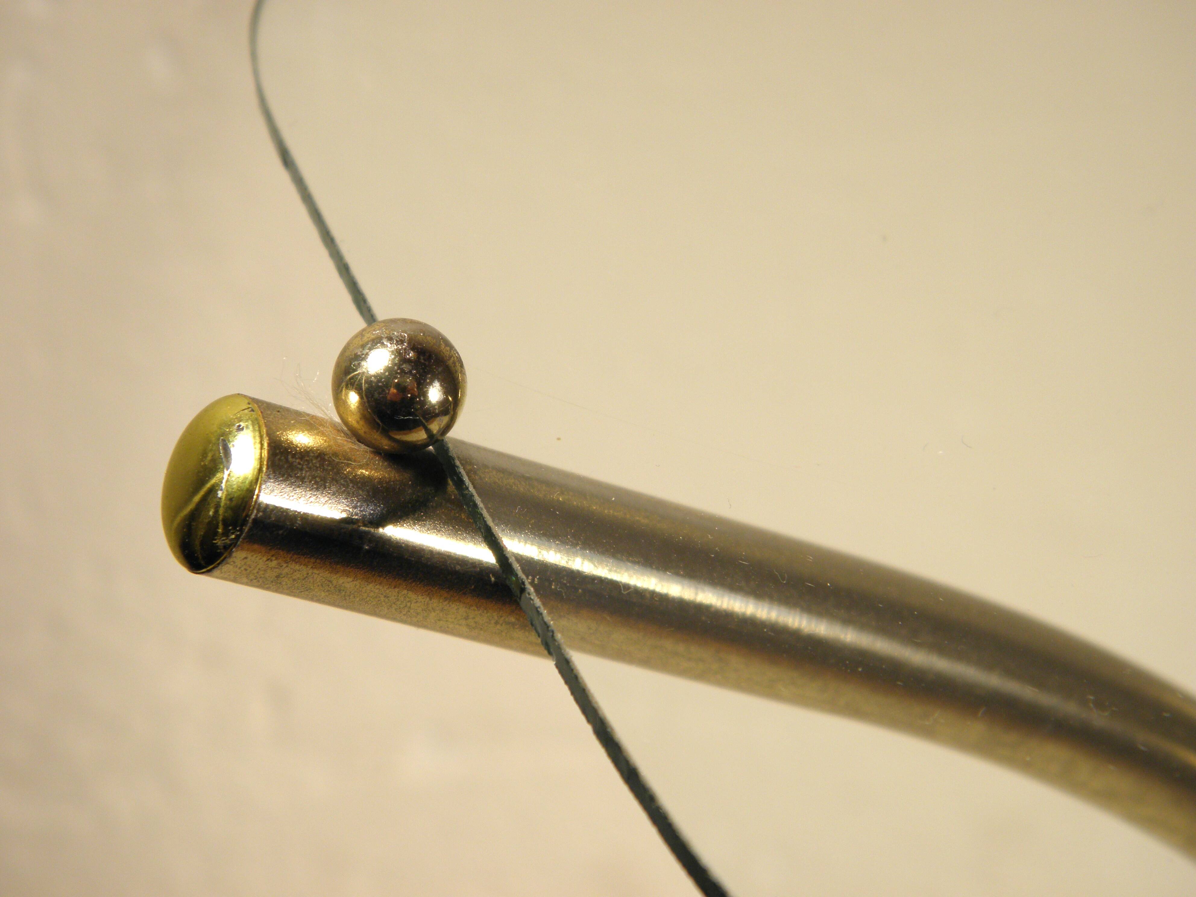 Tripod stand in gold metal and glass