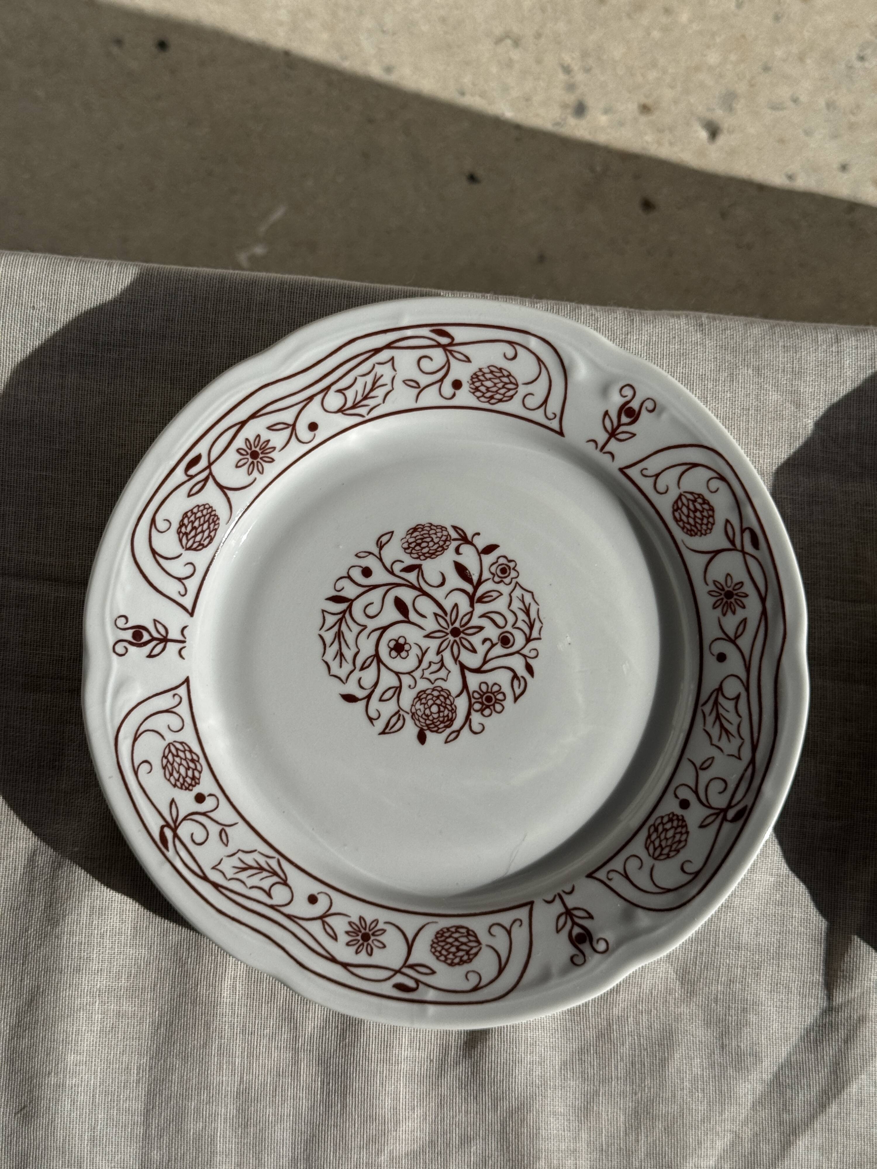 Set of 6 vintage dessert plates made in Poland with a plant motif.